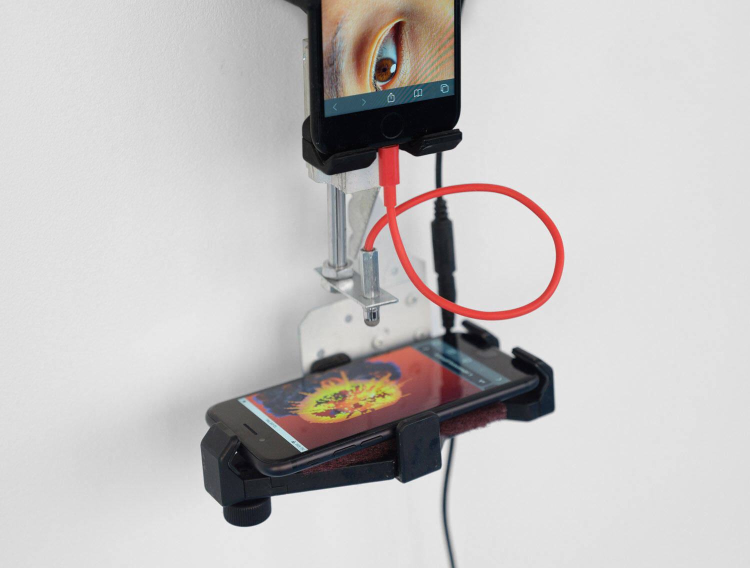 Yehwan Song, Witnessing, 2026 Two phone, divere materials, 38 x 18 x 12 cm