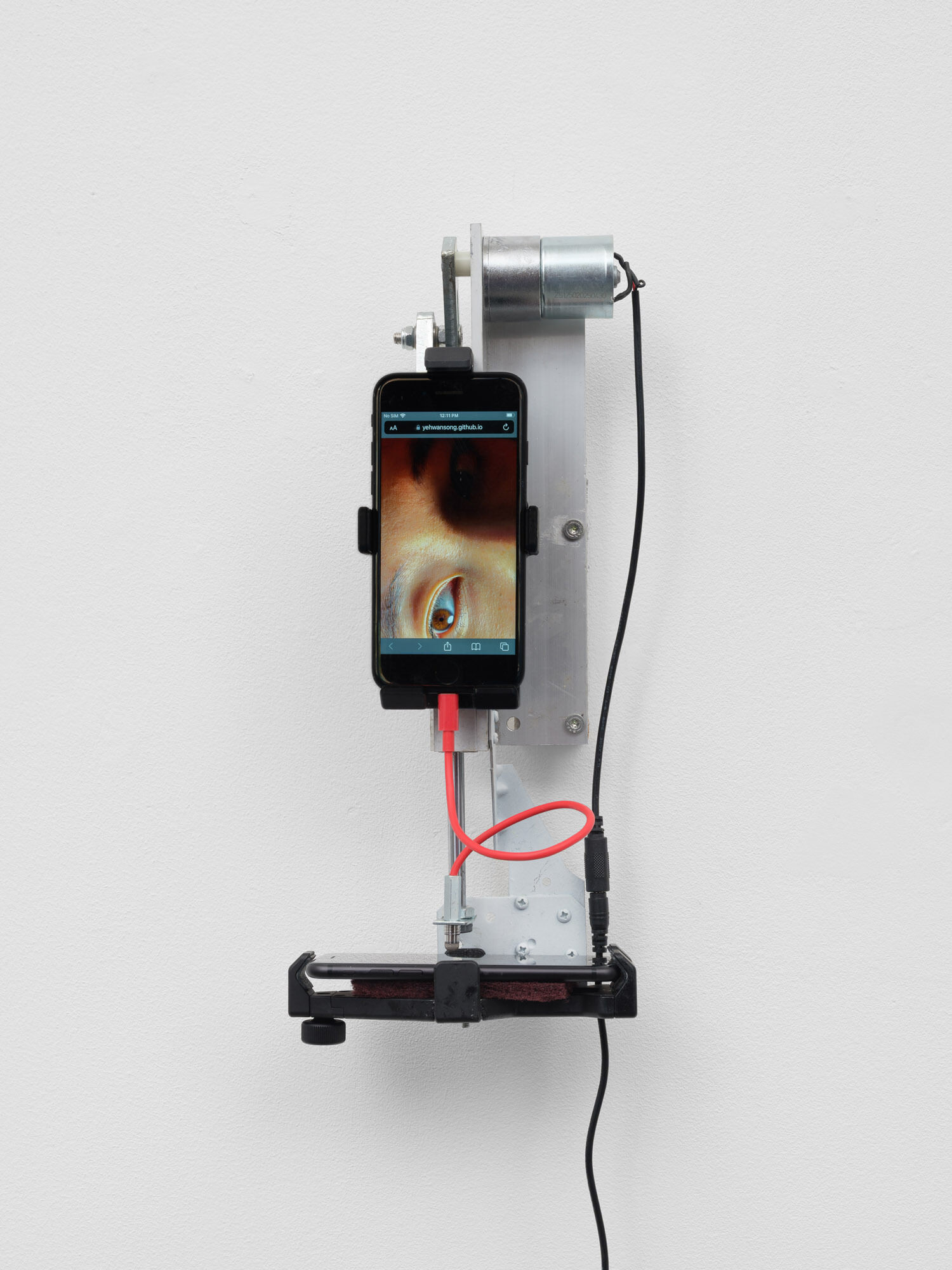 Yehwan Song, Witnessing, 2026 Two phone, divere materials, 38 x 18 x 12 cm