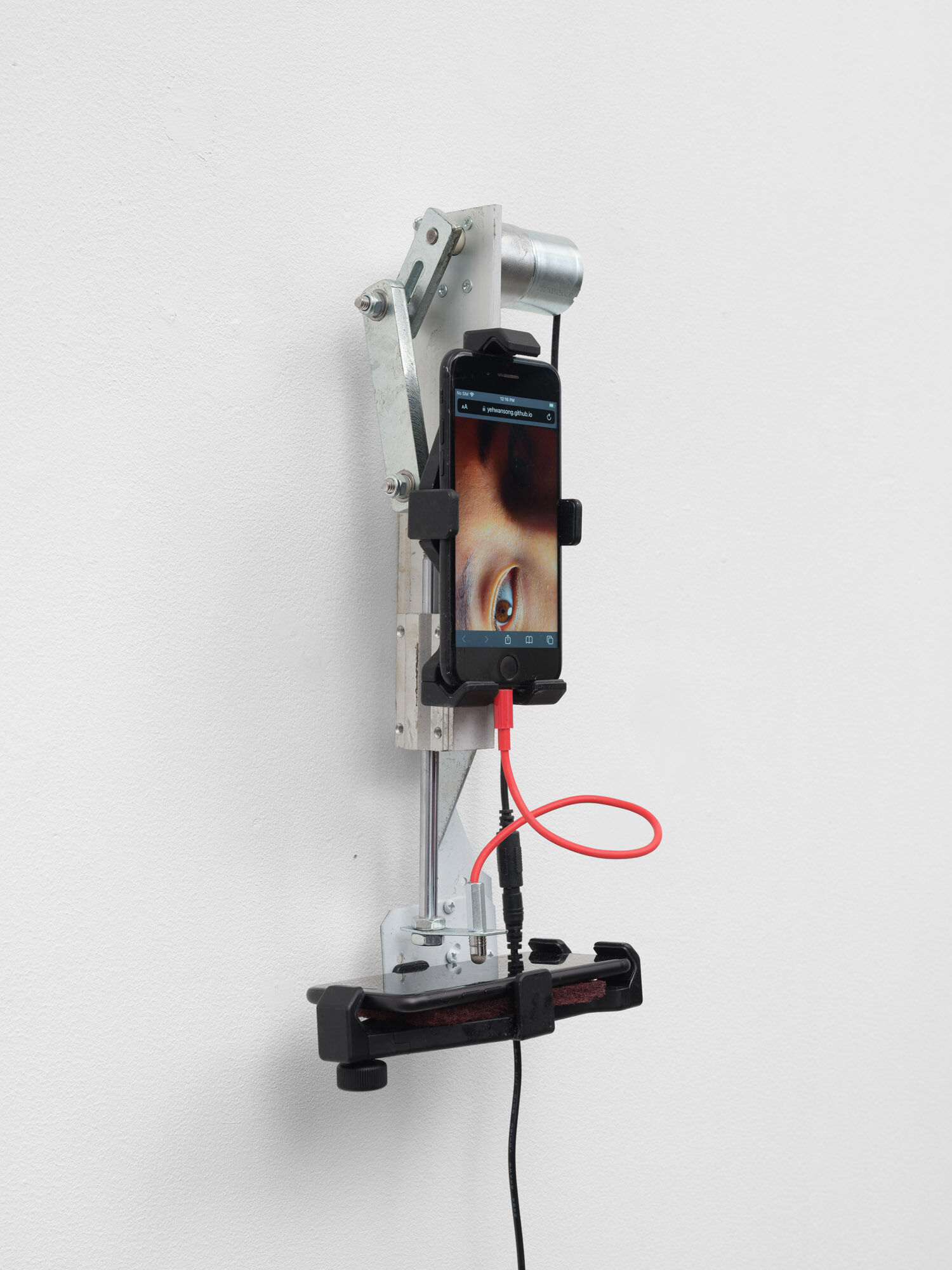 Yehwan Song, Witnessing, 2026 Two phone, divere materials, 38 x 18 x 12 cm