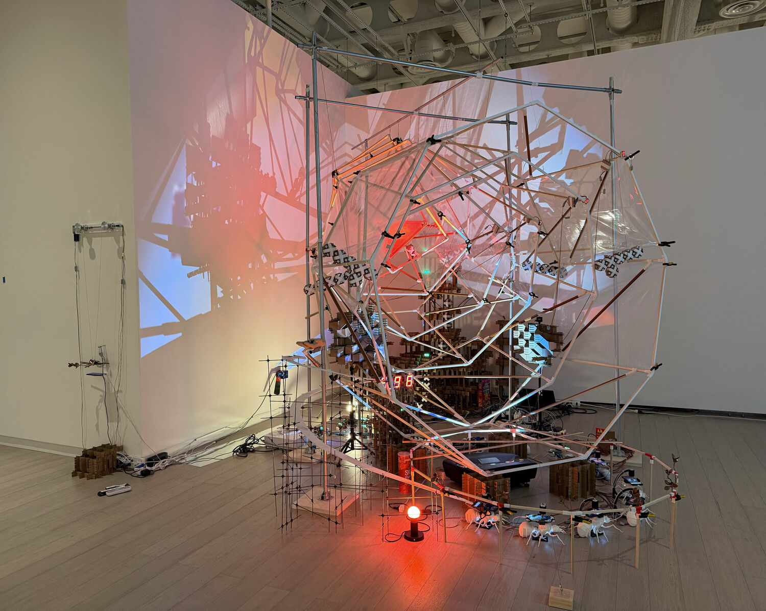 Yehwan Song, Adrenaline, 2026 Projection Mapping on Wood, Cardboard, EMT, Plastic, Metal, Mirror, Arduino, motor, Cellphones, Wrist Cell Phone Mounts, Arduino, Raspberry Pi / 10feet x 10feet x 10feet